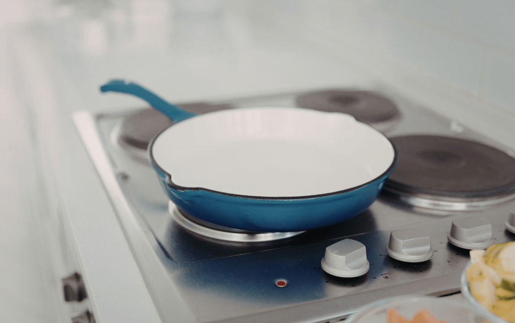 blue enamel cast iron pan on stovetop non toxic cookware low tox kitchen